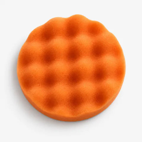 Orange wave foam pad included with Gloss Boss Max, showing the raised foam texture.